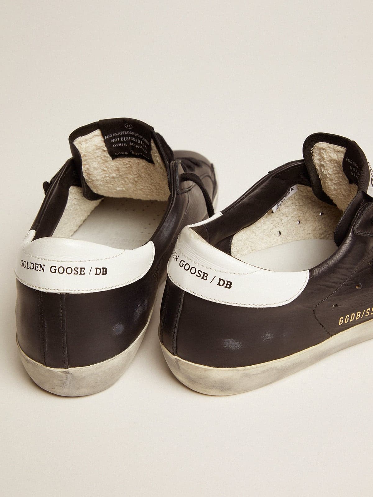 Women’s Super Star in black leather with white leather star and heel tab